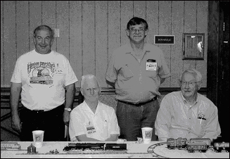 Pictured L-R: Larry Gilbreath, Gordon Lewis, Ron Ferrel, and Fred Dykes, all model train enthusiasts and members of the Pocatello Model Railroad and Historical Society, pose at the Daughters of the American Revolution meeting honoring railroading (May 2004).