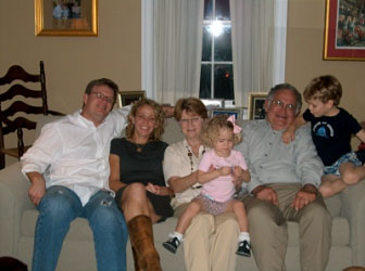 A family visit on Thanksgiving Day 2007, pictured L-R are: Les' son Matt and his wife Dianna; Les' wife, Gini, holding their granddaughter Maggie; Les; and grandson, Matt Jr.