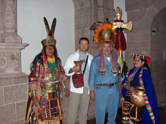 Les and son, Paul (center R-L), pose with the locals in Macchu Picchu, Peru, considered one of the world's most sacred sites, in 2005. 